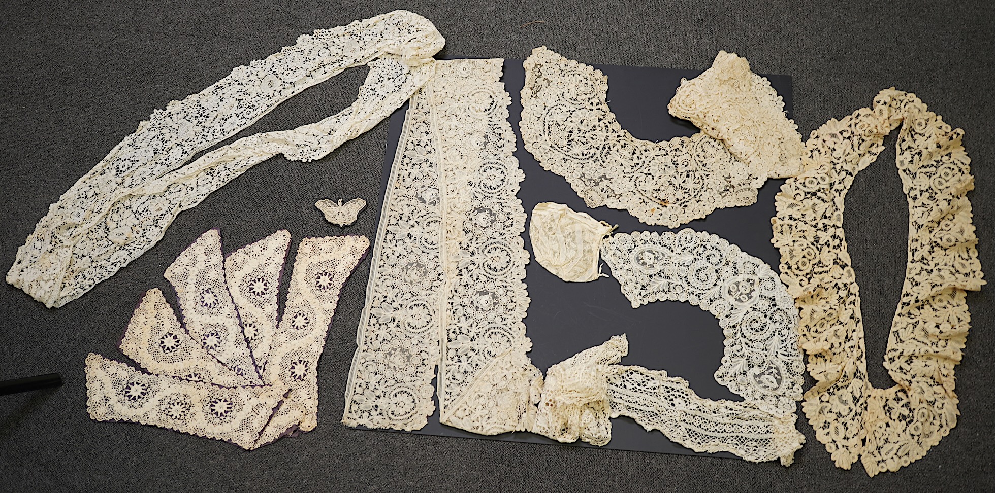 A mixed Brussels bobbin lace and Point de Gaze lace collar, another smaller collar, a similar length of trim and butterfly motif, together with a Brussels bobbin collar and trim, an Irish crochet cuffs, a Valenciennes la